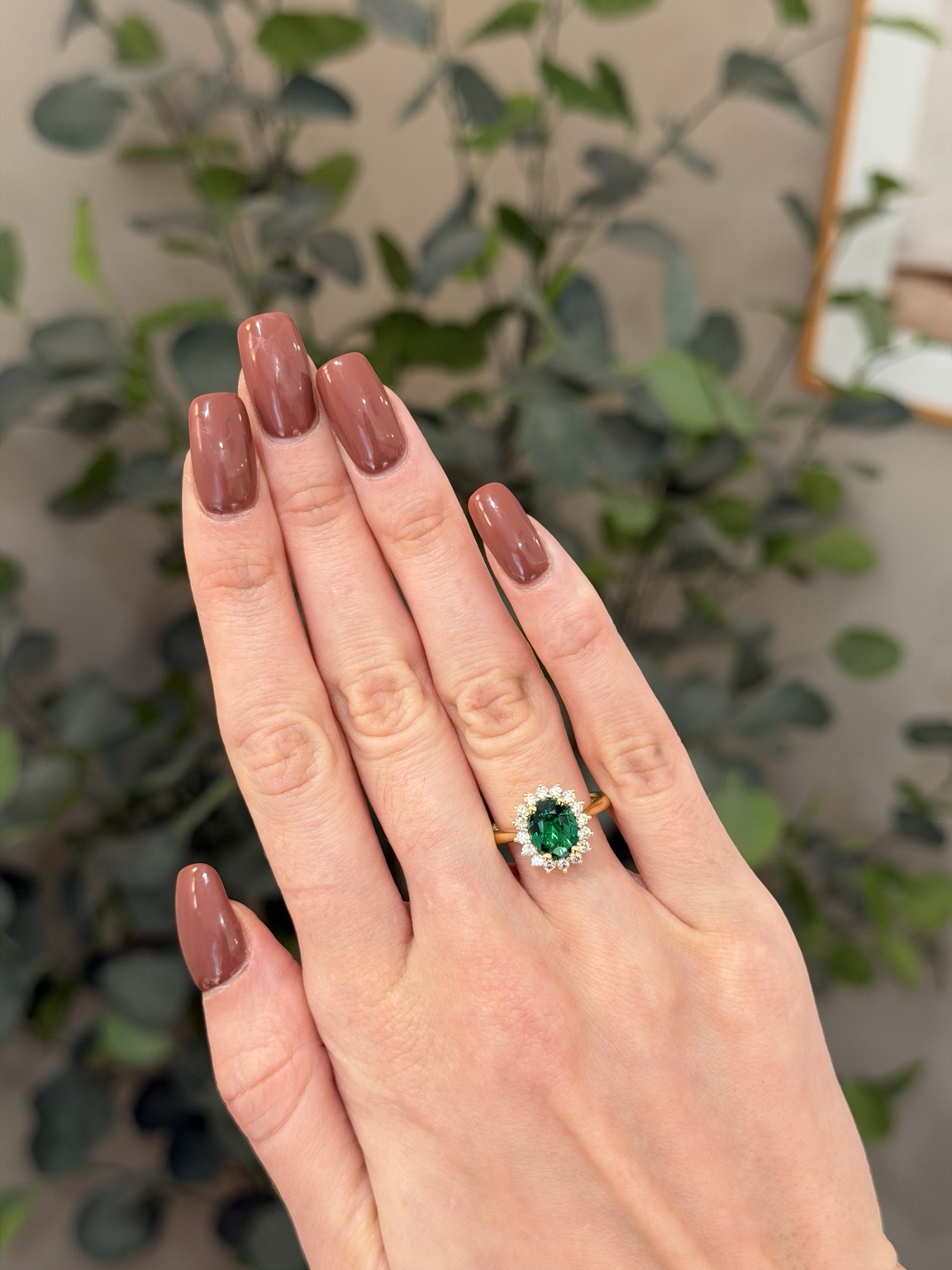 Monjélee ring with a green gemstone